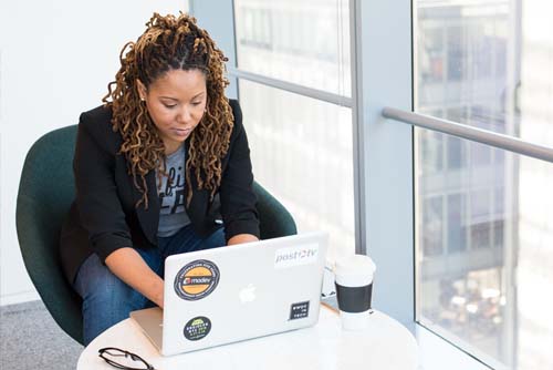 young woman working on laptop